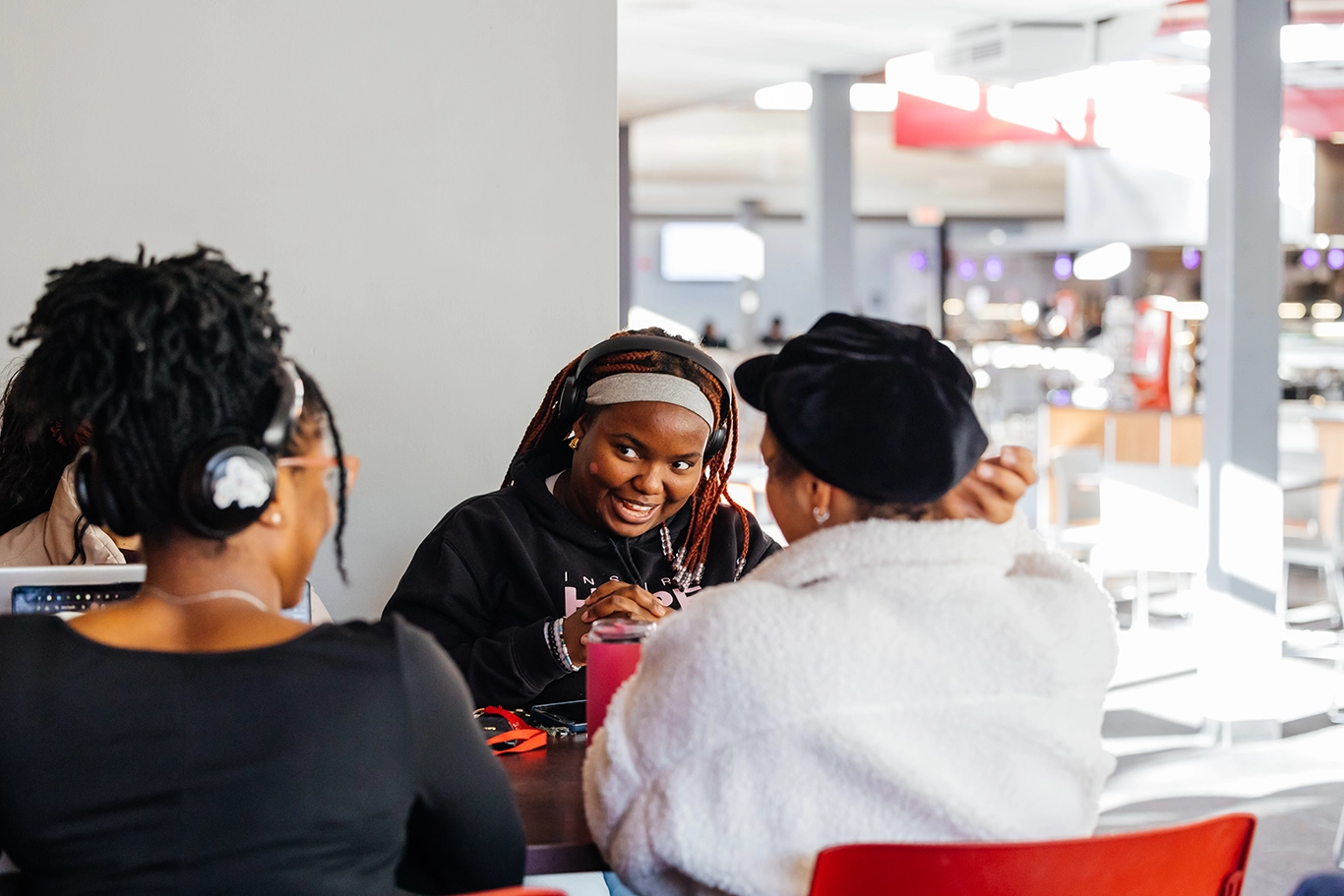 Four students sitting at a table studying