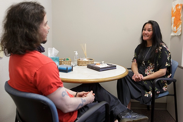 Counselor and student talking