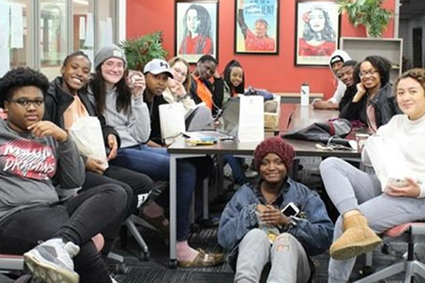 Group of students sitting at a table in the Intercultural Center